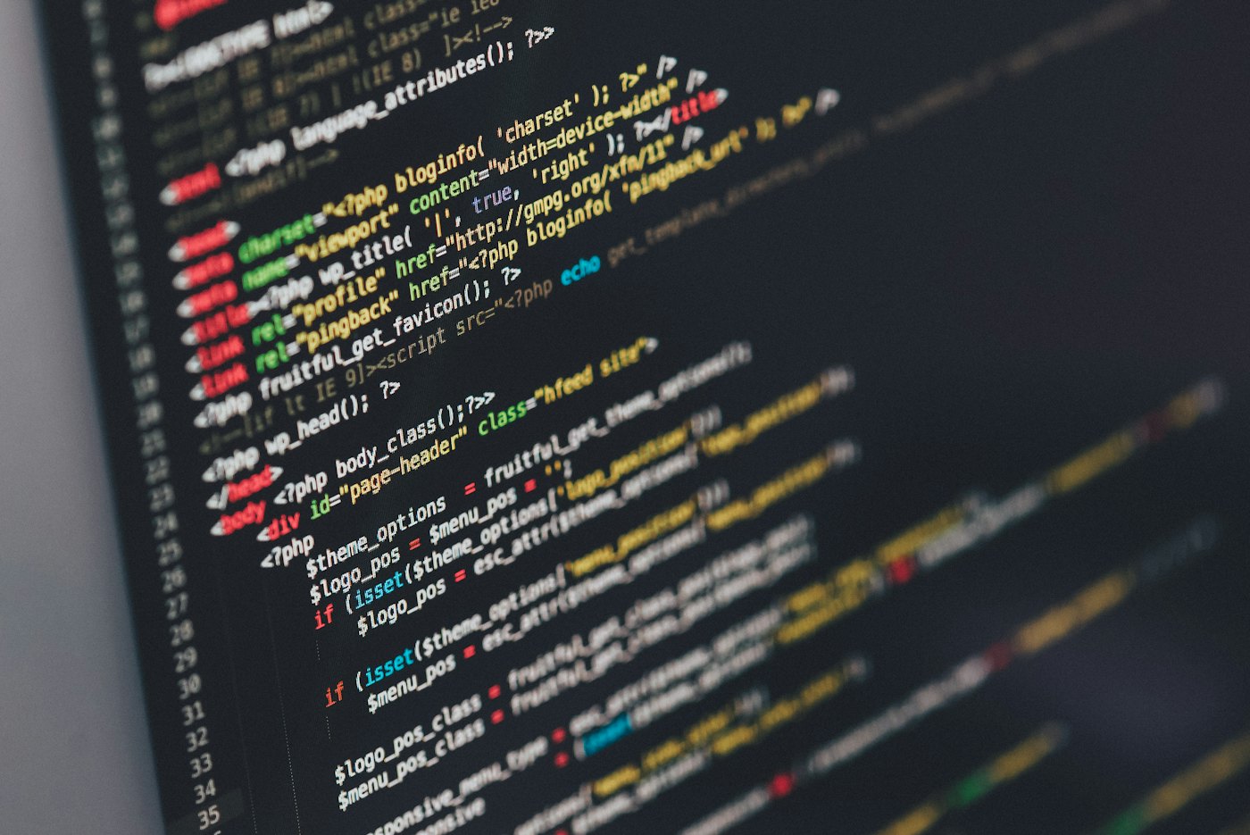 Generated app code on a laptop screen