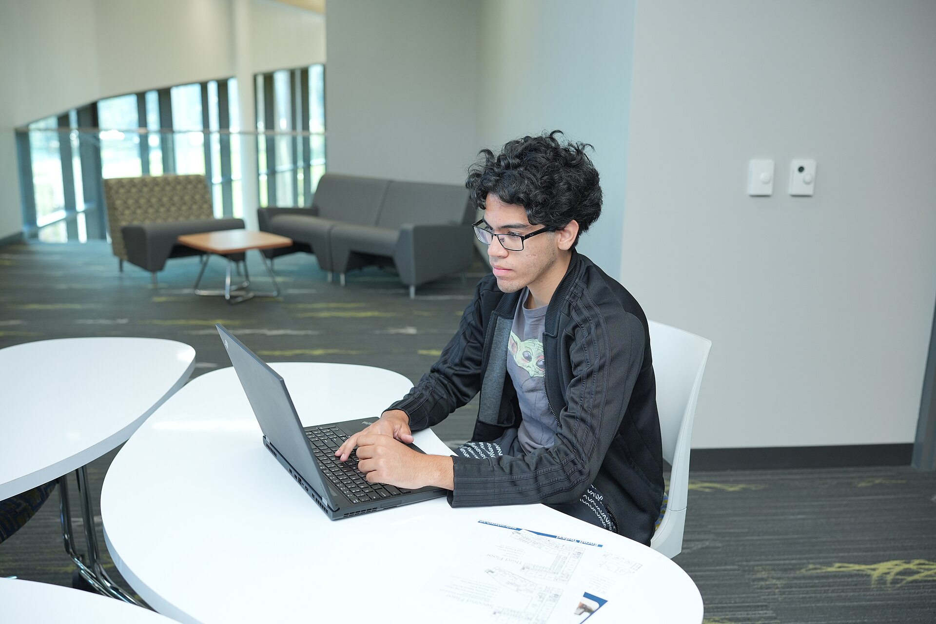 A student building an app on a laptop